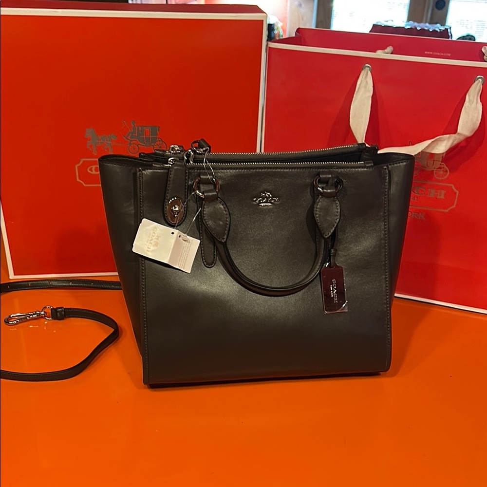 Coach brown leather bag with handles and shoulder strap. Brand new with tags.